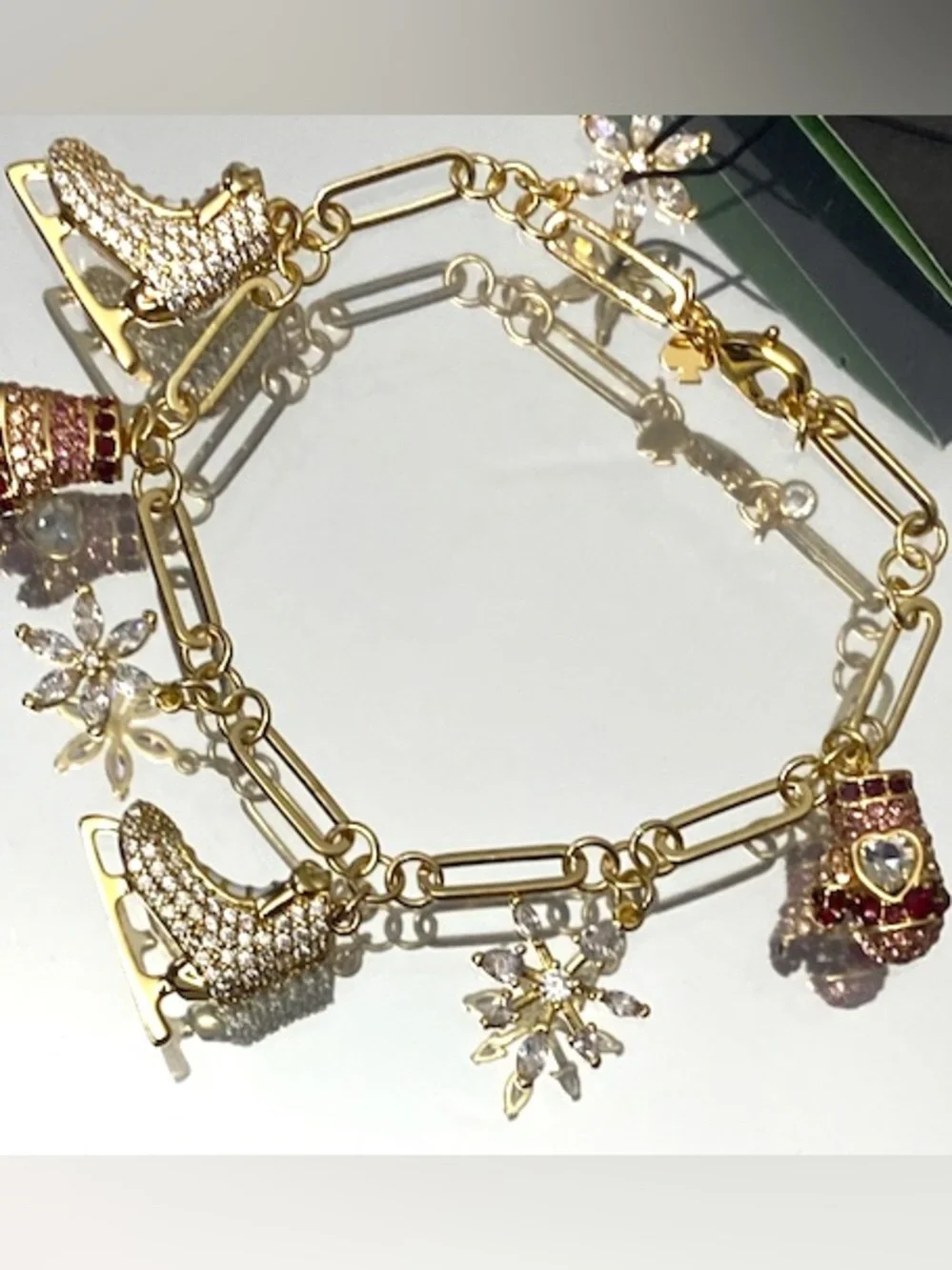 kate spade Gold-Tone Ice Skate & Snowflake Charm Bracelet with Pink Accents - Picture 6 of 9